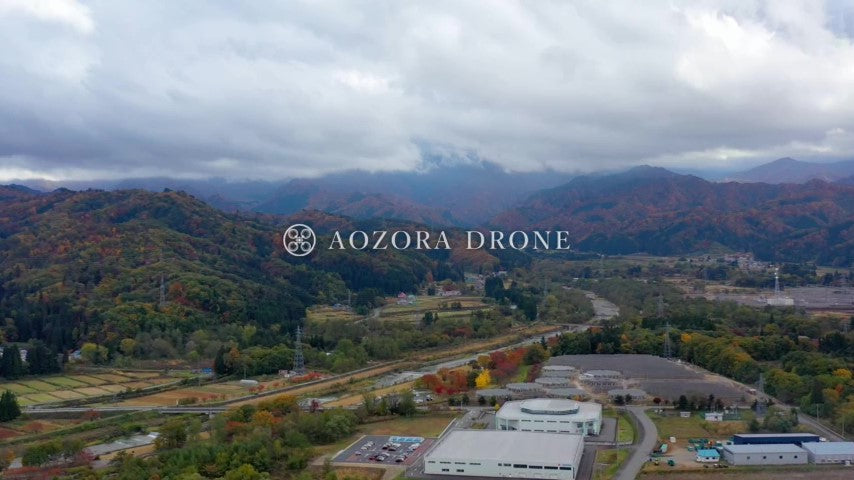 Factory in Yonezawa city and autumn leaves Drone aerial video footage [Yamagata prefecture Yonezawa city, Japan]