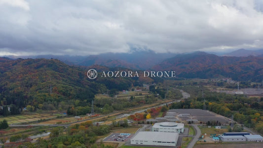Factory in Yonezawa city and autumn leaves Drone aerial video footage [Yamagata prefecture Yonezawa city, Japan]